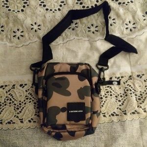 A Bathing Ape shoulder bag.